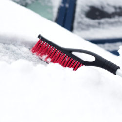 Black Brush Used to Get Snow Off Car