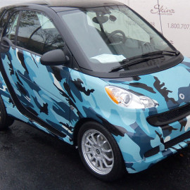 Blue camo vehicle wrap on smart car