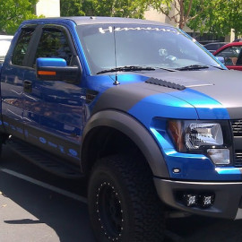 Matte black and metallic blue Ford truck
