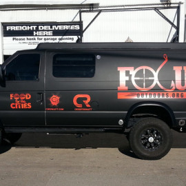 Matte black van wrap with logo for business