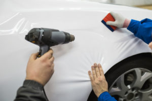 heat gun installing a car wrap